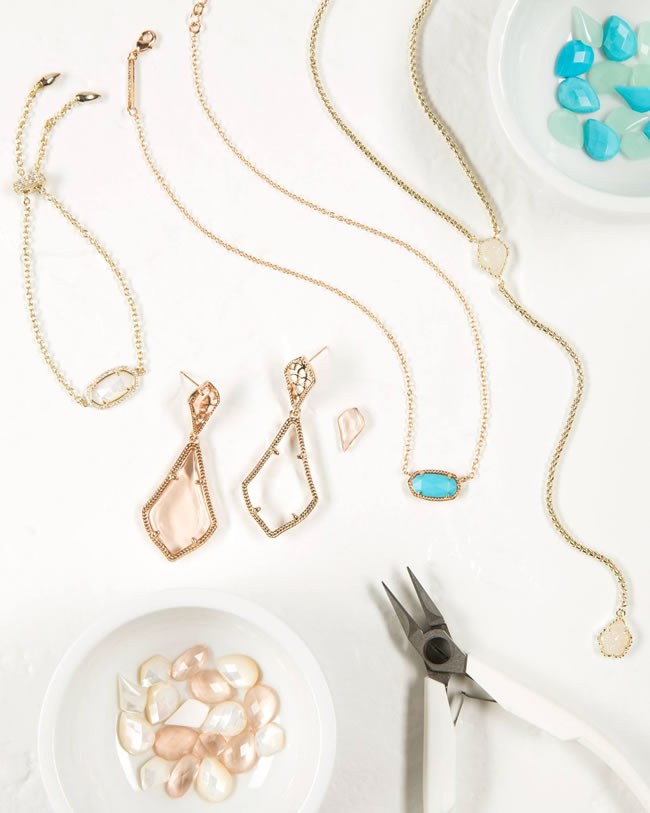 Loose gems, earrings, necklaces and pliers: ready to assemble the Color Bar jewelry