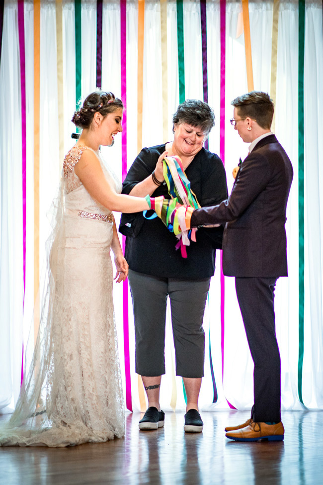 LGBTQ+ Wedding Ideas | Colorful ceremony backdrop + rainbow handfasting LGBTQ+ Wedding Ideas | Colorful ceremony backdrop + rainbow handfasting