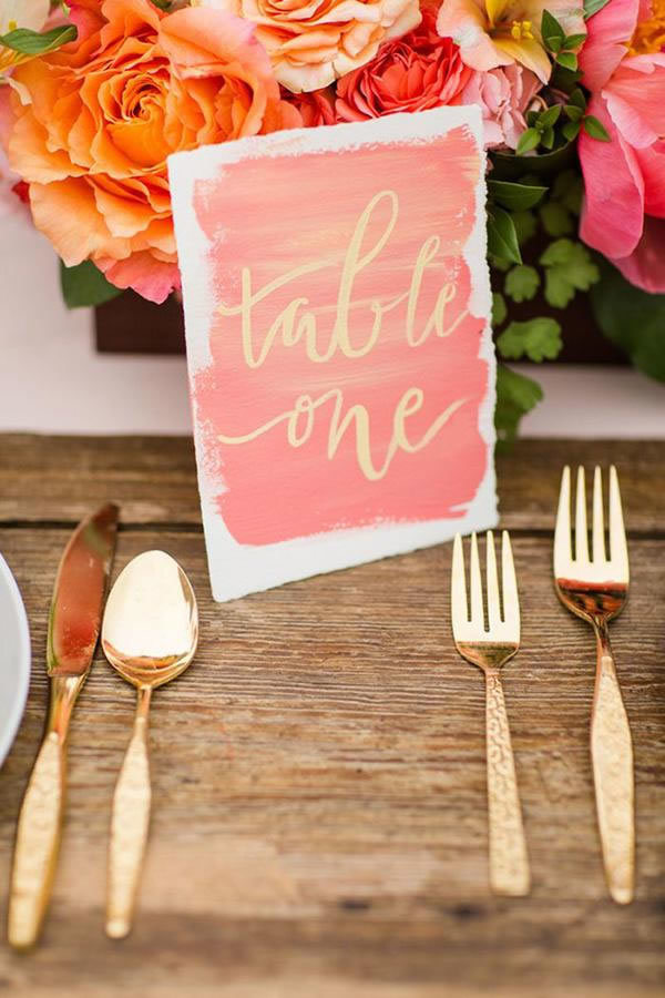 Living Coral table number with gold calligraphy