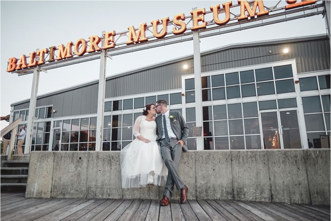 Baltimore Museum of Industry Wedding Newlyweds kissing in front of Baltimore Museum of Industry