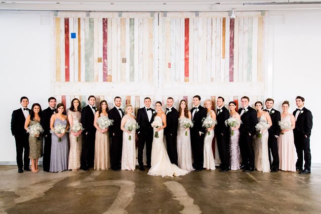 Mason Fine Art and Events, Georgia Wedding Venue A bridal party poses in front of a mural at Mason Fine Art and Events