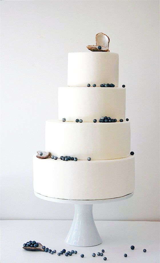 Beach wedding décor idea: Pearl wedding cake Fondant wedding cake dripping with pearls and topped with an oyster shell