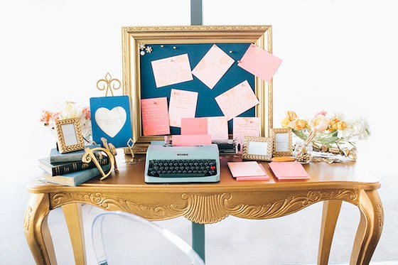 I'm engaged, now what? A desk with typewriter, notes, and wedding planning supplies