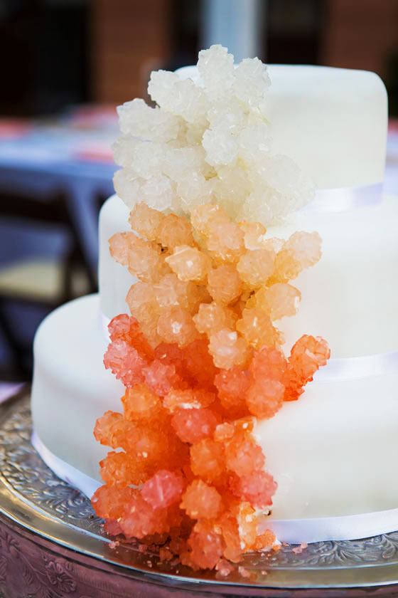 Beach wedding décor idea: Coral wedding cake Wedding cake with ombre rock candy that looks like coral