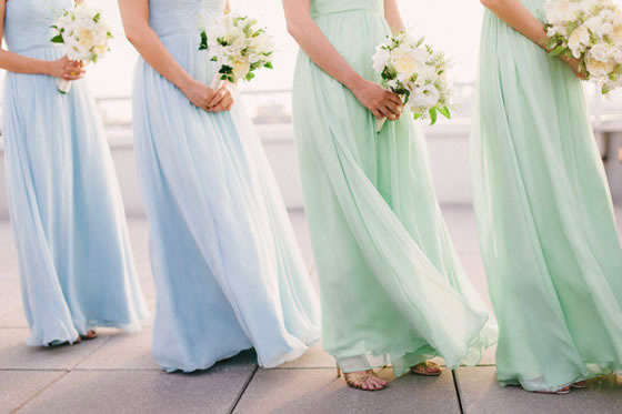 Beach wedding décor idea: Sea glass colored bridesmaid dresses Bridesmaids in sea glass colored dresses