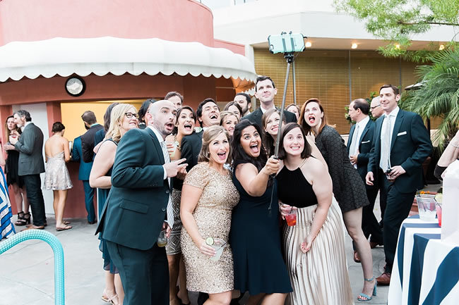 Wedding guests with a selfie stick Wedding guests with a selfie stick