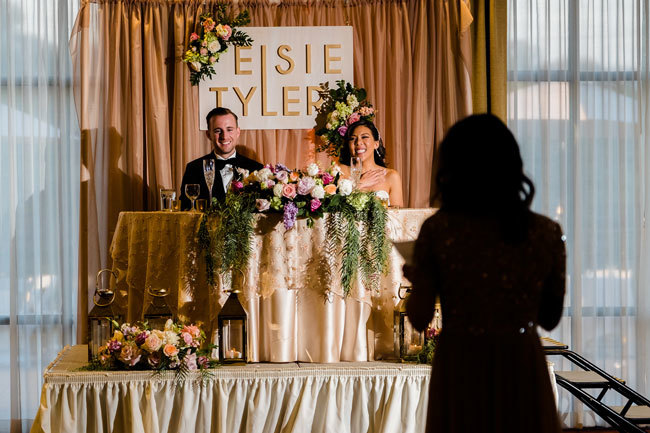 Newlyweds laugh at the Maid of Honor's speech Newlyweds laugh at the Maid of Honor's speech