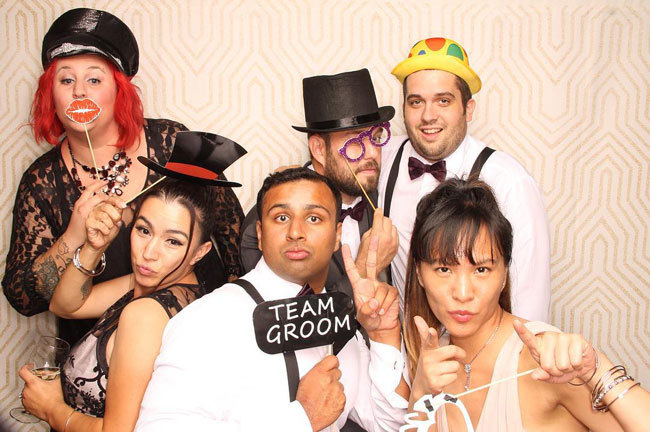 Wedding guests use photo booth props | Snapfiesta Wedding guests use photo booth props | Snapfiesta