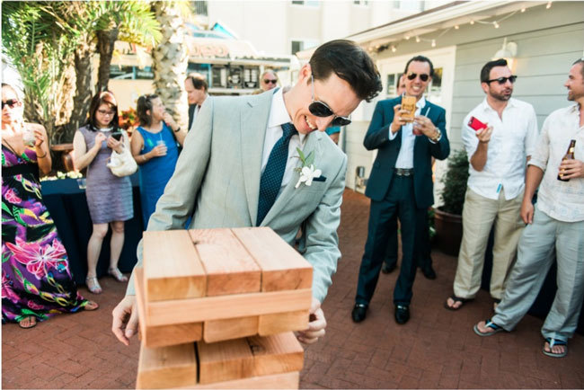 Wedding guest plays giant Jenga Wedding guest plays giant Jenga