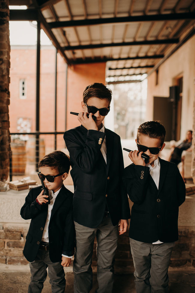 Kids as "Wedding security" with sunglasses and walkie-talkies Kids as "Wedding security" with sunglasses and walkie-talkies
