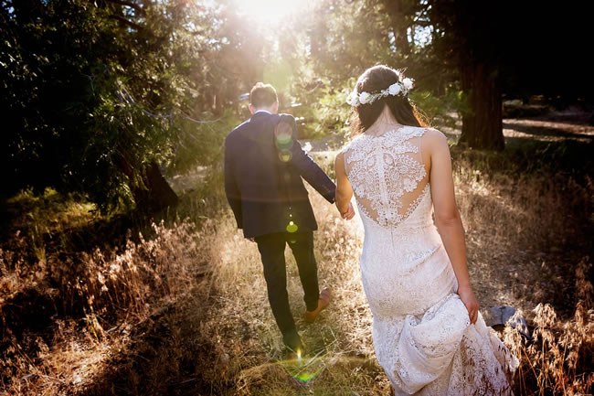 How To Keep Sane When Wedding Planning Gets Hard A newlywed couple walking hand-in-hand together
