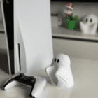 ps5 dualsense controller with ghost buddy stand on desk