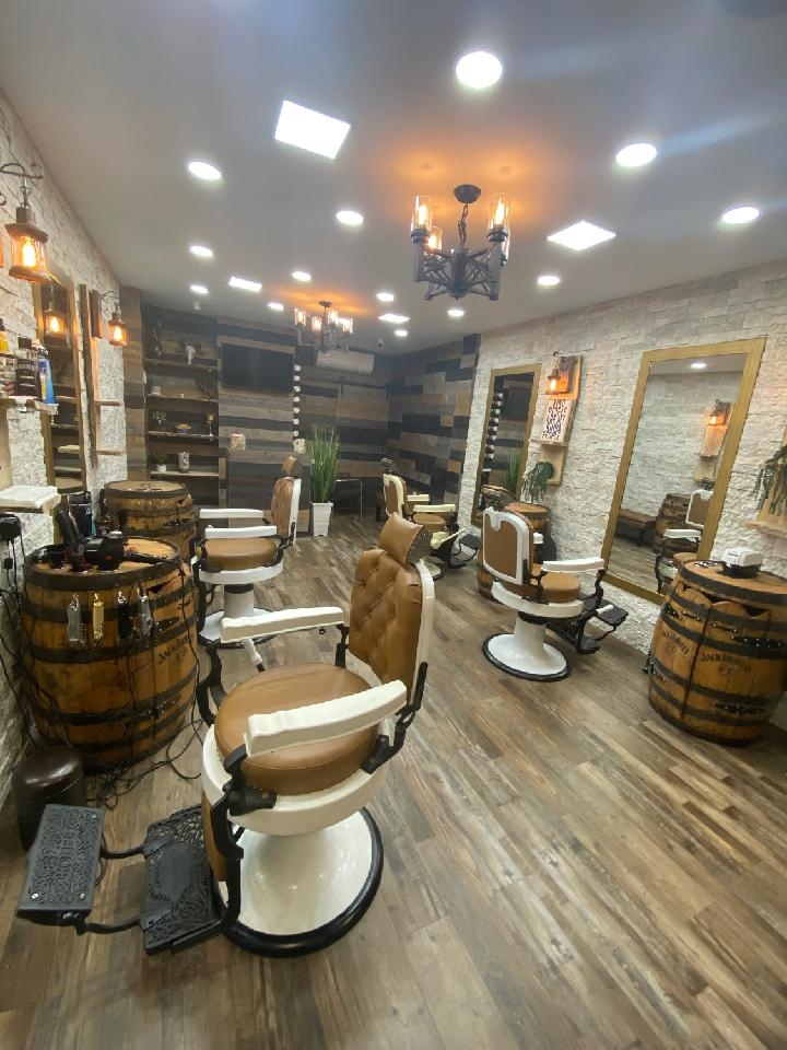 How often should one visit the barber to maintain a sharp drop fade with slick back style?