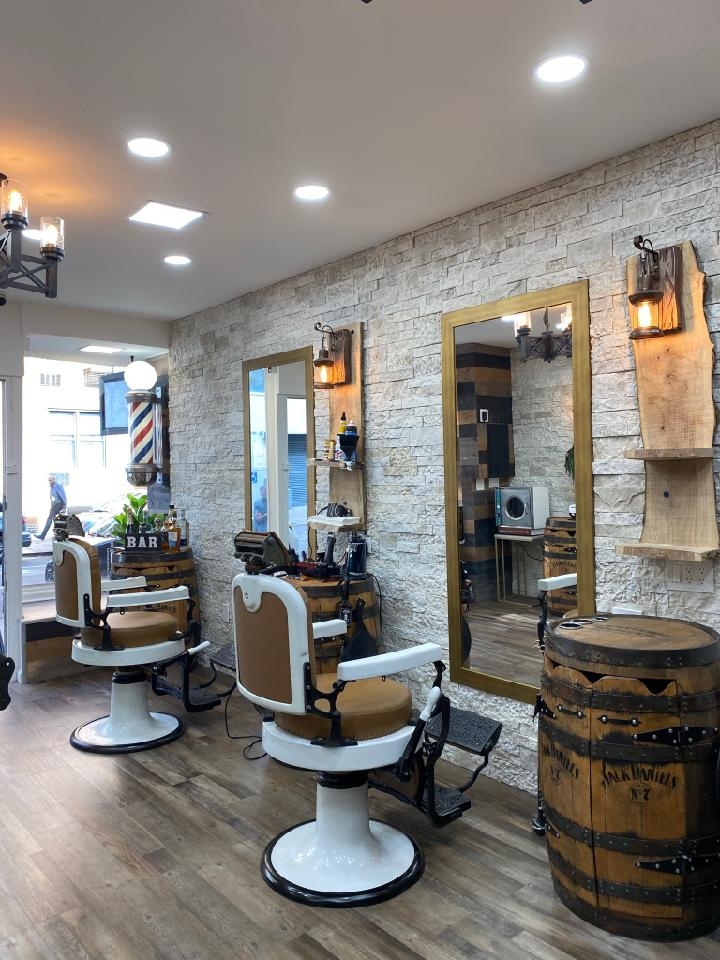 How often should someone with a low taper fade and angular fringe haircut visit the barber for maintenance?