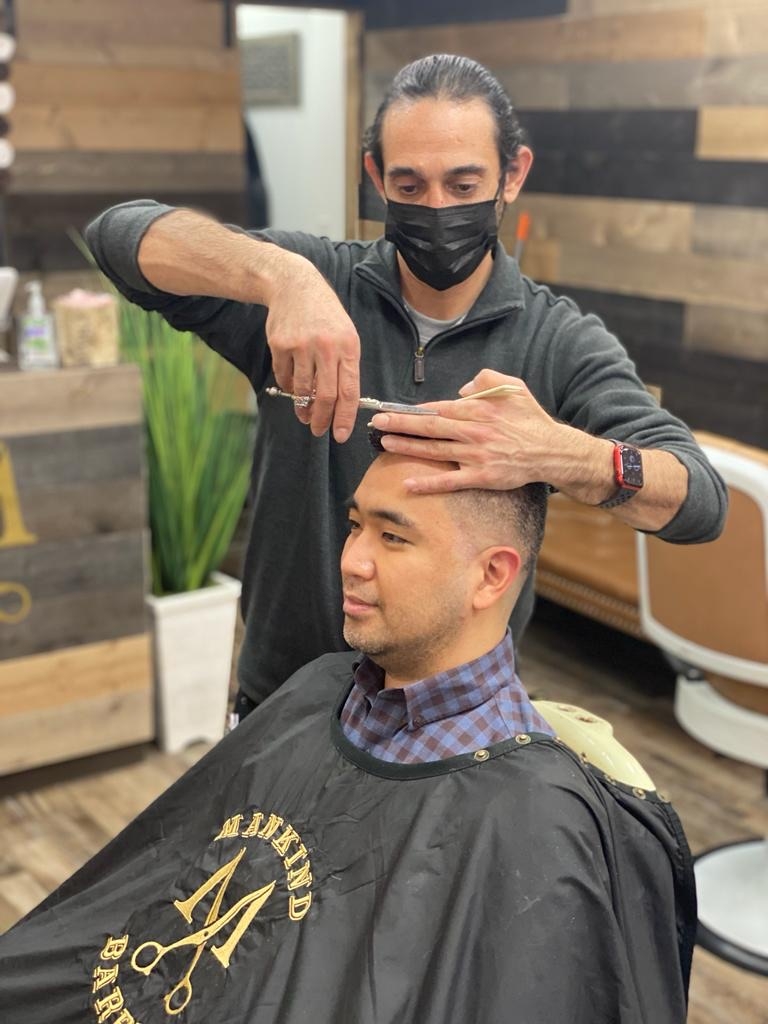 How can someone with thin or fine hair make their mid skin fade with faux hawk hairstyle appear fuller and more voluminous?