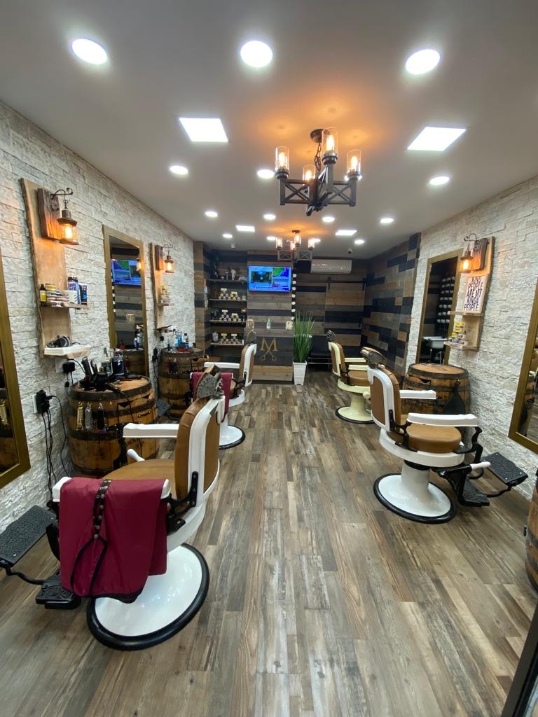 How often should someone with a taper fade haircut with a hard line design visit the barber for maintenance?