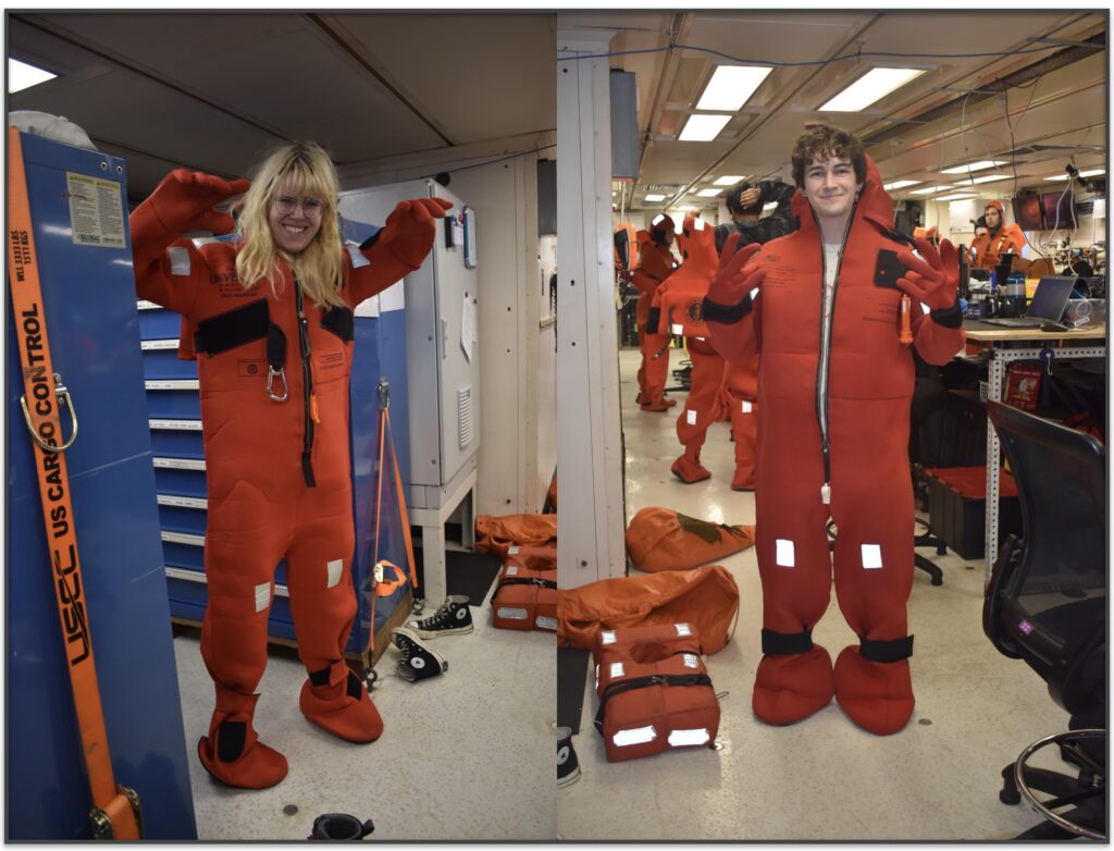 Recent UW School of Oceanography and Marine Biology graduates -Ada Carter and Oliver Parsons - don survival suits during safety training as the R/V Revelle steams to the Oregon Shelf site. Credit: M.Elend, University of Washington, V26.