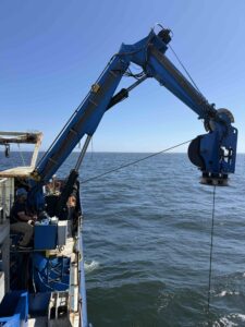 The crane holding Jason off the boat as the ROV is coming back up to the surface from Dive J2-1775. Credit: J Campbell, University of Washington; V26