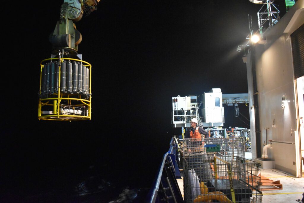 CTD going over the side for a shallow water profile. Credit: A. Carter, University of Washington; V26