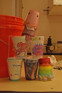 Styrofoam cups decorated by Izzie, Avery, and Maddy. Credit: I. Fatland, Cornell University; V26.