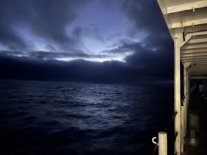 Ominous looking night sky with dark clouds and black-looking seas.