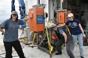 VISIONS'26 students Izzie Fatland, Maddie Talbot, and Avery Wolf show off their handy work after cleaning a Shallow Profier Science Pod Controller recovered by Jason. Credit: J. Thrityacre, University of Washington, V26.
