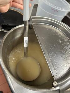 Choice 12 oz. One-Piece Stainless Steel Ladle with Gray Coated Handle