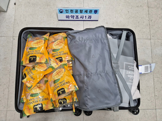 Two Thai nationals arrested for allegedly trying to smuggle cannabis hidden in dried mango