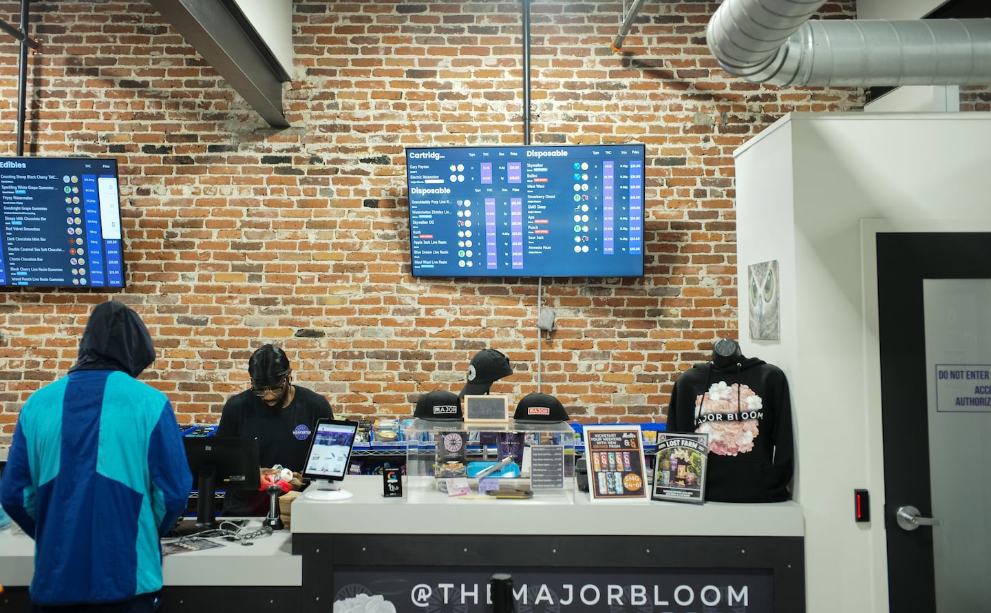 Ulysses Youngblood, owner of Major Bloom in Worcester, waited on a customer.