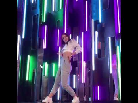 TasyaMini goes in dancing with colorful background