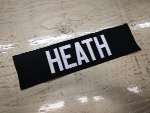 Custom jersey nameplate, black nameplate with white text