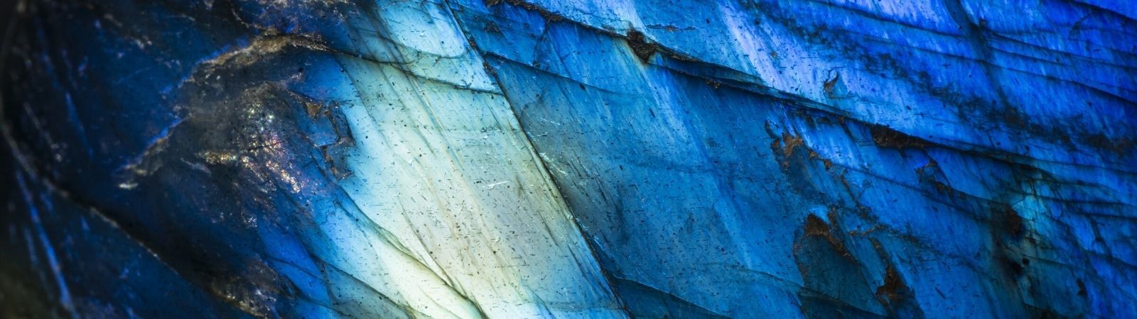 Close up view of polished cobalt with gradient blue colors throughout with lots of shine.