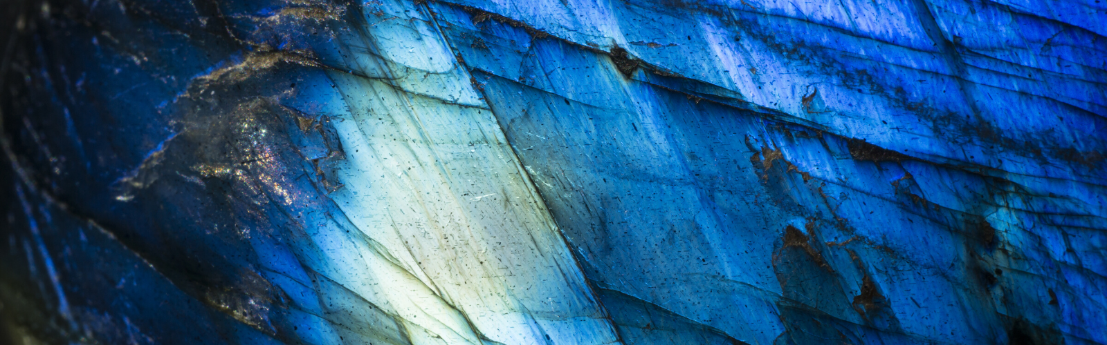 Close up view of polished cobalt with gradient blue colors throughout with lots of shine.