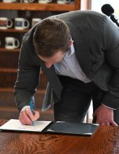 Northwest Seaport Alliance Co-chair Ryan Calkins signs an interlocal agreement during a signing ceremony on Thursday, February 5, 2026.