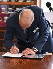 Port of Walla Walla Commissioner Kip Kelly signs an interlocal agreement during a signing ceremony on Thursday, February 5, 2026.