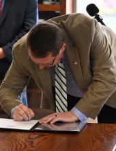 Port of Walla Walla Executive Director Pat Reay signs an interlocal agreement during a signing ceremony on Thursday, February 5, 2026.