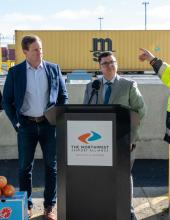 A photo of the speakers near the podium during a question-and-answer session at the press conference for the new gate complex and reefer plugs at Terminal 5 in Seattle.  