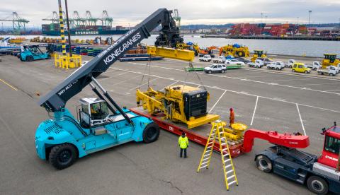 Reach stacker lifting cargo at a breakbulk terminal.