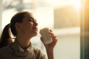 A digital marketing agency employee drinking coffee