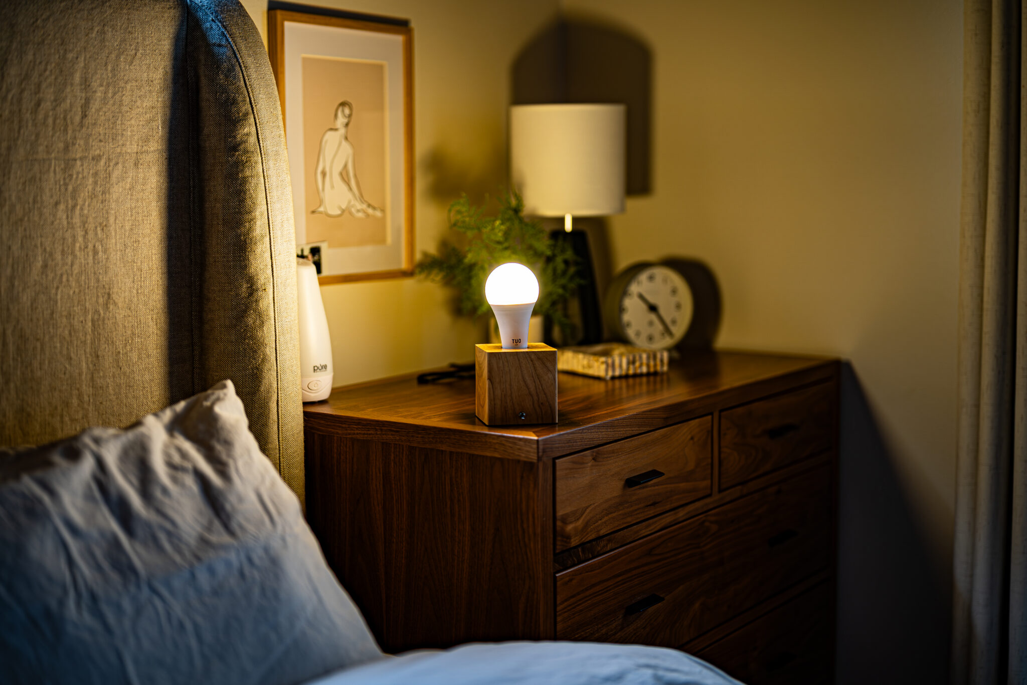 lit tuo light bulb on bedroom side table
