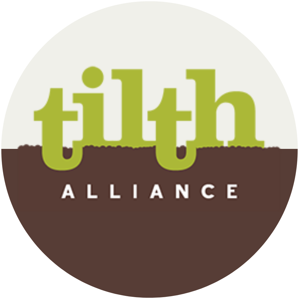 Logo for Tilth Alliance featuring the word tilth in large green letters above the word ALLIANCE in white, all set against a background split horizontally between off-white and brown—about balance and connection to the earth.