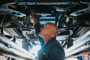 Car being examined at Bucky's Midway Auto Repair