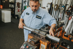 pipe being cut at Bucky's Auto repair puyallup