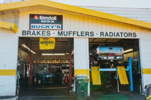 truck on lift being repaired at Bucky's Tacoma Narrows Auto repair location