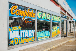 Bucky's Bremerton Auto Repair painted signs with deals