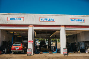 Car being repaired in 3 car garage at Bucky's Bremerton Auto Repair
