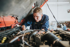mechanic diagnosing issue at Bucky's Bremerton Auto Repair