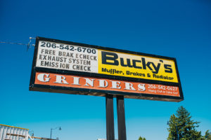 Bucky's Shoreline Auto repair location's billboard