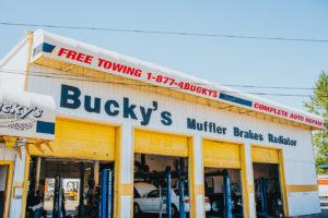Car being repaired in the garage at the lynnwood Bucky's Muffler Brakes & Radiator location