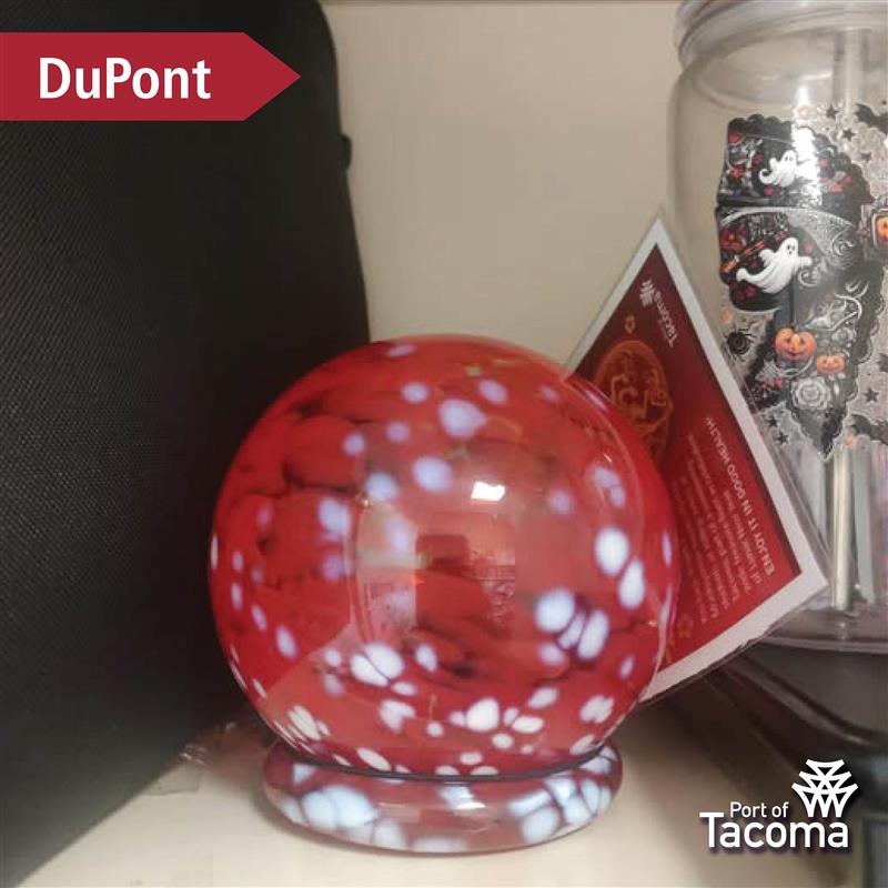 Up close shot of a red Monkeyshines token with the word "DuPont" typed in the corner